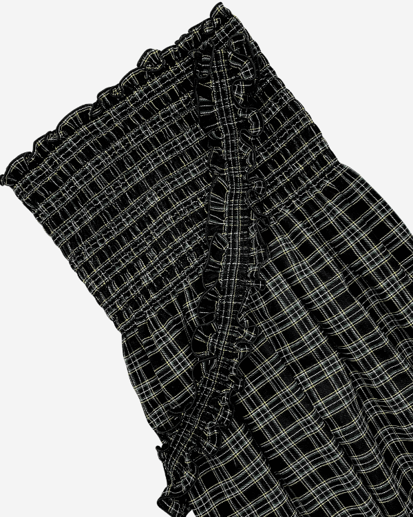 Black plaid smocked fabric closeup with shirring detail