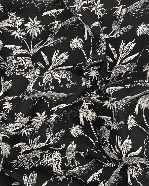 Black White Jungle Safari Toile De Jouy Fabric | Cotton 58"W | Photo of fabric in a draped ball 