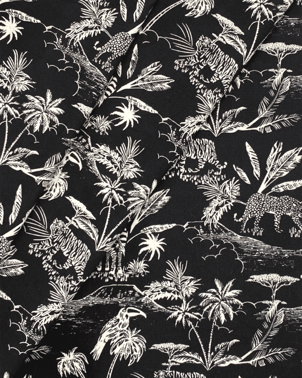 Black White Jungle Safari Toile De Jouy Fabric | Cotton 58"W | Photo of fabric folded