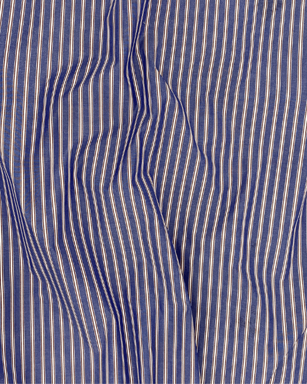 Closeup of navy, purple, and white woven stripe cotton textile