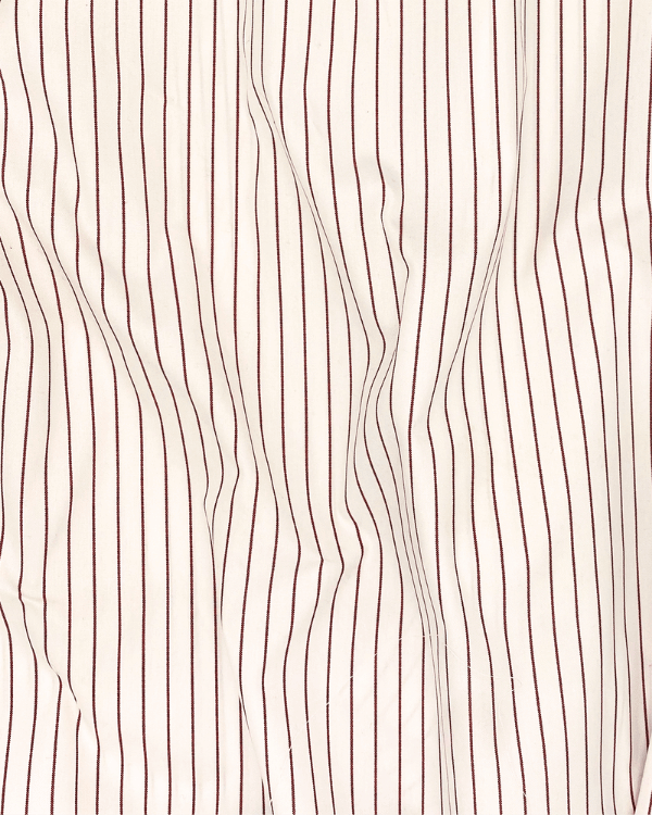 Red and creamy white striped cotton fabric shown draped for texture