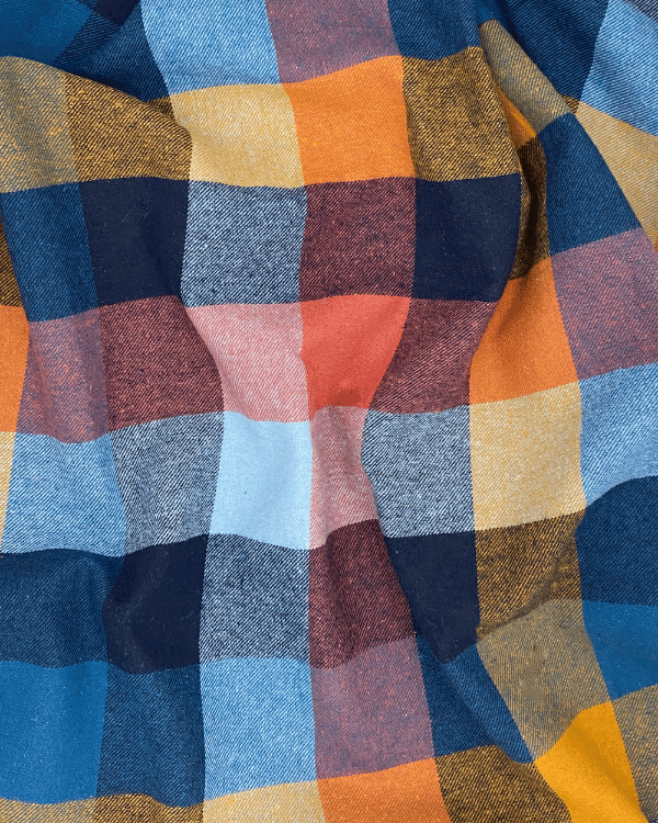 Draped navy rust mustard plaid cotton flannel fabric – 58” wide by the yard.