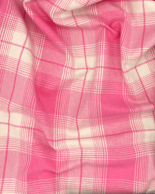 Pink plaid cotton flannel fabric draped to show soft texture and flow