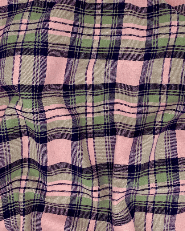 Draped pink and green plaid cotton flannel fabric