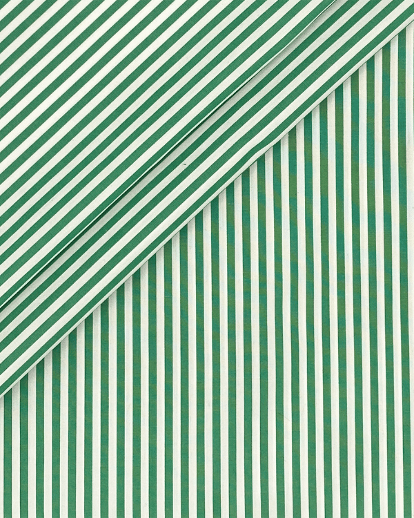 Folded green stripe yarn-dyed cotton fabric close-up