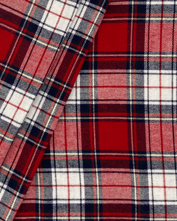 Folded red plaid flannel fabric in soft brushed cotton