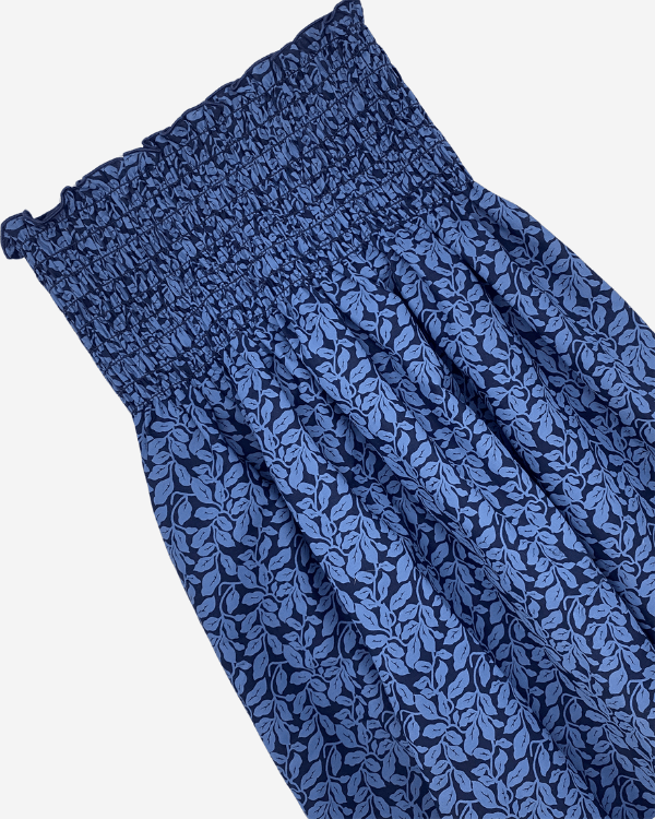 Blue leaf cotton fabric with 5 inch shirred edge, 28 inch wide  Pre-shirred smocked cotton fabric for girls’ dresses and tops  Smocked blue floral fabric by the yard with matching strap  Close-up of blue leaf print shirred cotton 28 inch wide  🔢 MPN (Inc