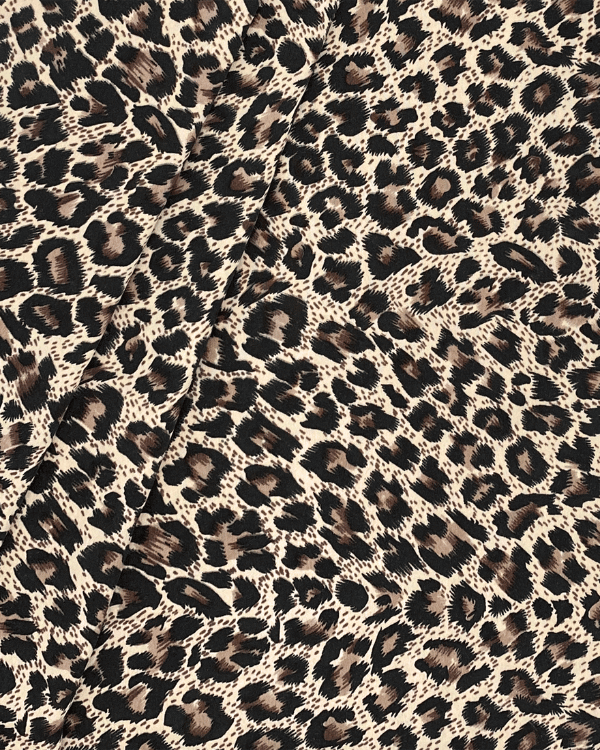 Close-up of leopard animal print polyester fabric folded