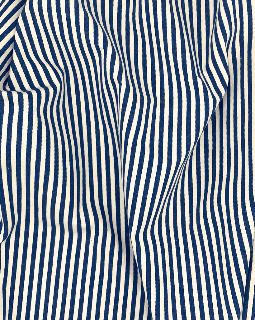 Draped navy and cream striped cotton twill fabric with crisp texture