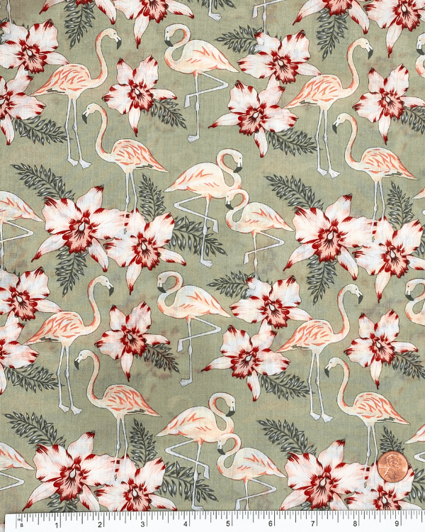 Flamingo floral cotton fabric with ruler for scale, 58” wide sage green background.