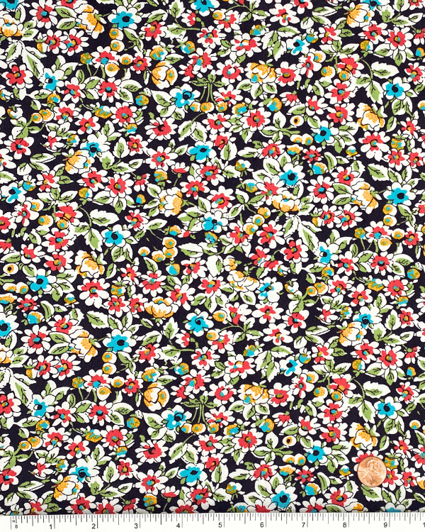 Brown ditsy floral cotton fabric with ruler for scale, showing small-scale vintage inspired flower print, 58 inch wide cotton yardage.