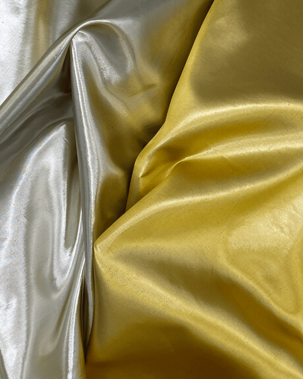 Chic Reversible Metallic Lame Fabric | Silver, Gold, and 100% Glam | 58 WideGold and silver metallic lame fabric for when regular fabric just won’t cut it. Flowy, shiny, and reversible – it’s the showstopper your sewing stash needs.Threadymade