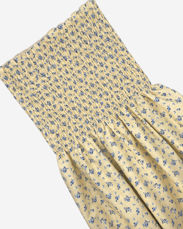 Pre-shirred yellow blue floral cotton fabric with 8-inch shirring, sold by the yard for dresses, skirts, and tops.