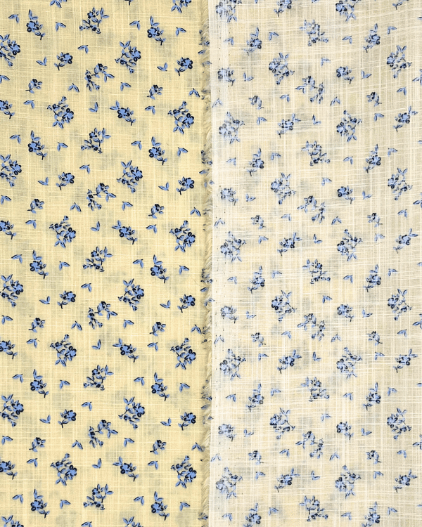 Cotton fabric close-up showing slub weave and delicate florals showing front and back of fabric