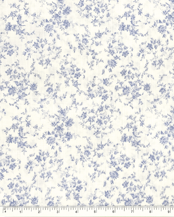 Vintage-inspired blue floral cotton slub fabric with ruler for scale, 58 inches wide, lightweight and breathable fabric for sewing projects