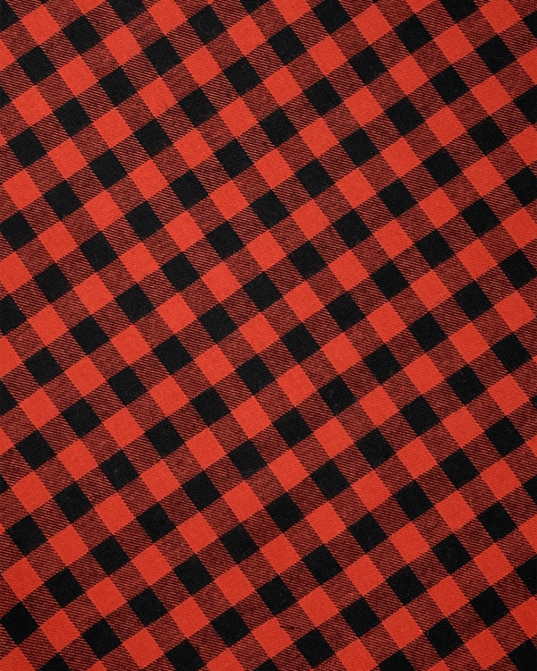Deep Red and Black Buffalp Plaid Fabric for Sewing in Cotton Flannel Twill shown on the bias