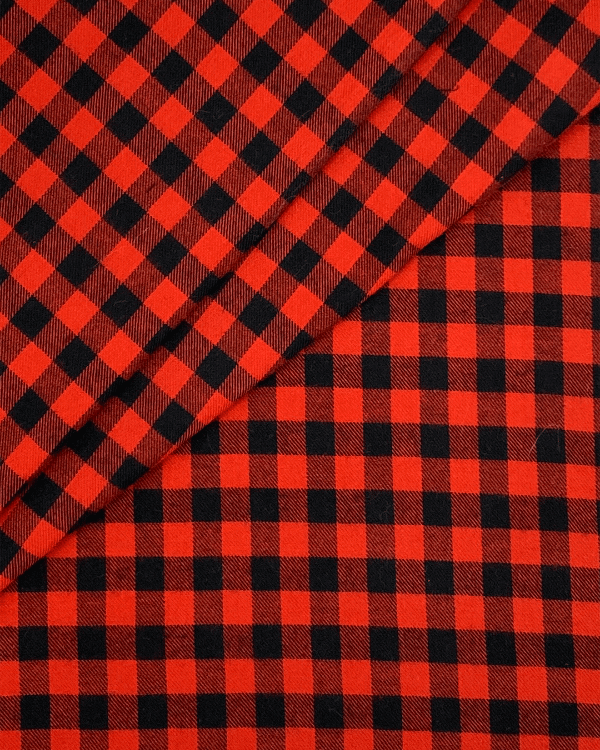 Deep Red and Black Buffalp Plaid Fabric for Sewing in Cotton Flannel Twill shown with folds for direction